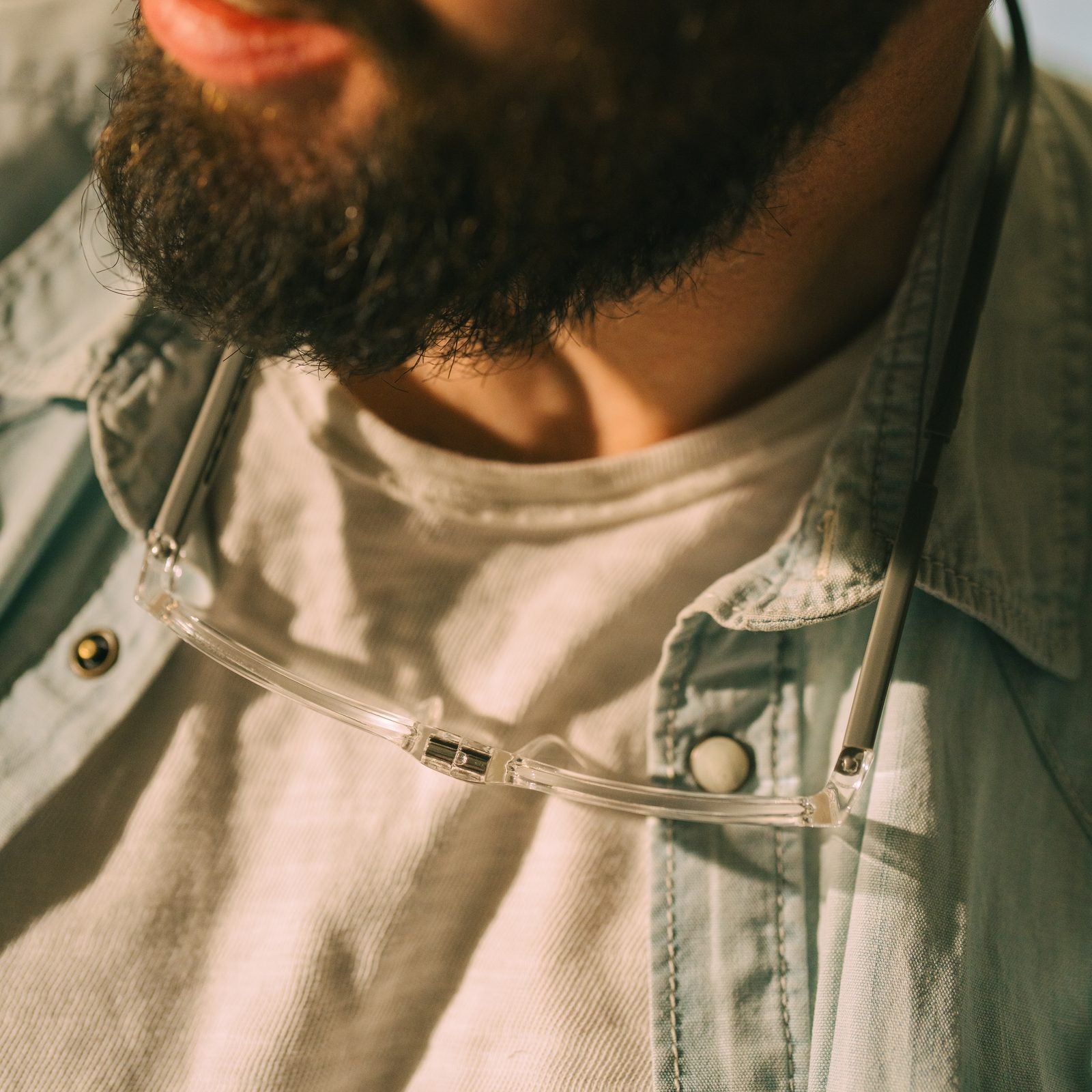 CliC readers hanging open at the neck of a bearded man